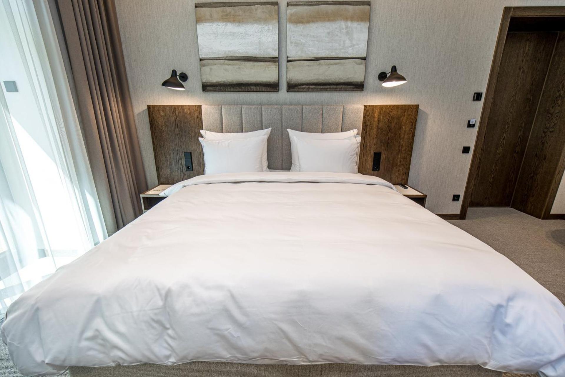 Palanga Life Balance Spa Hotel Room photo A bed with a duvet